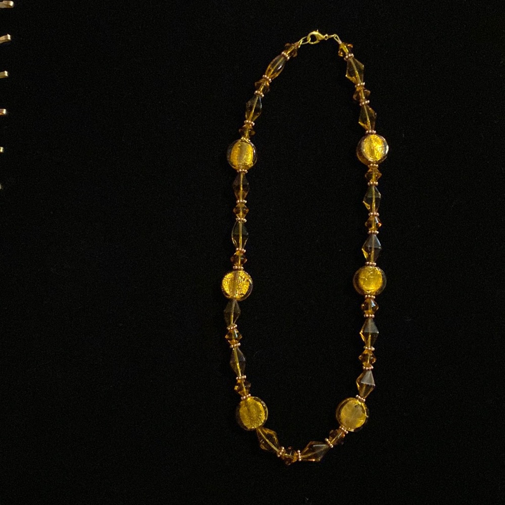hand Made beaded necklace gold beads with rose gold spacers very unique.